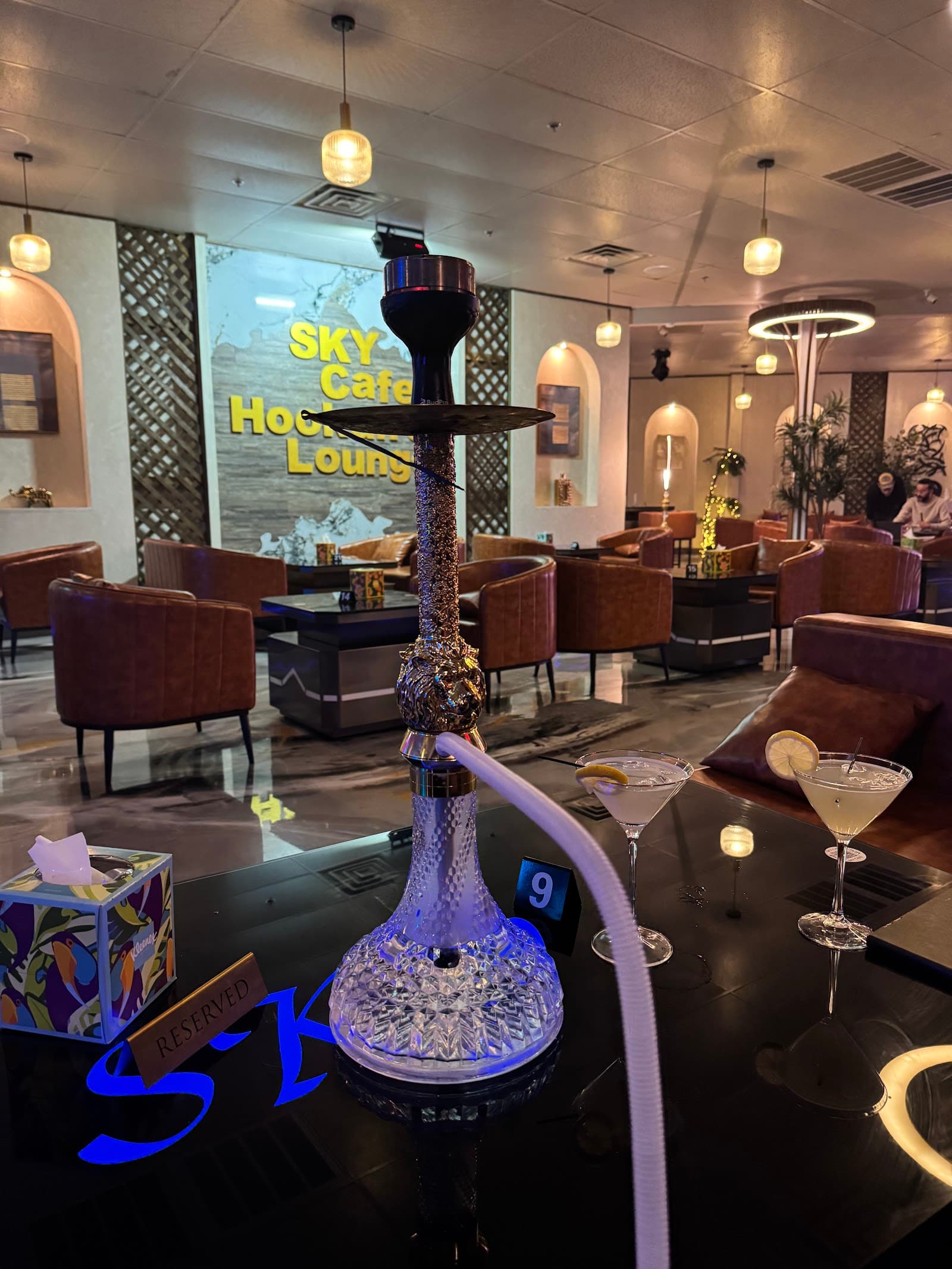 Crystal hookah and two lemon drop martinis on the glowing SKY table